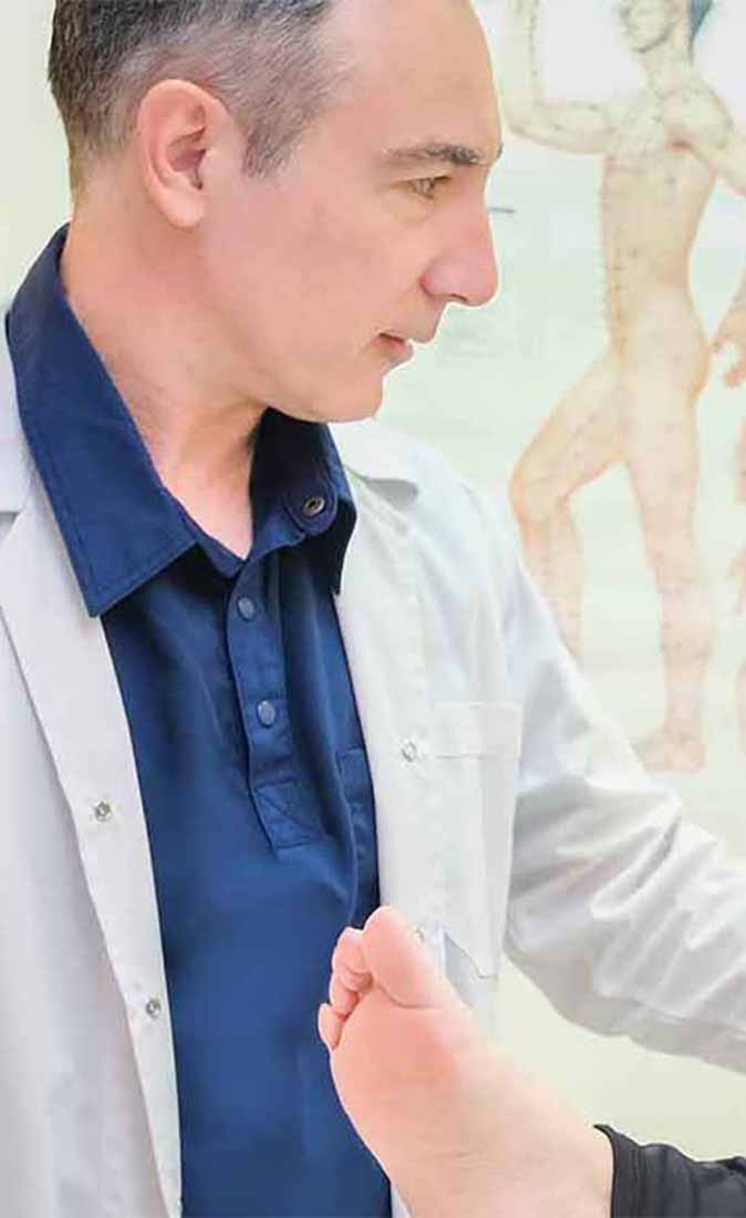 Dr Danalis treating patient